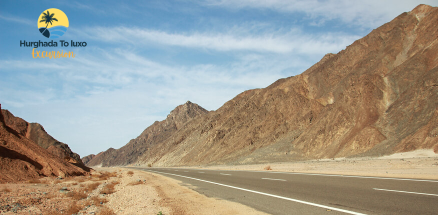 Desert highway connecting Hurghada to Luxor at sunrise